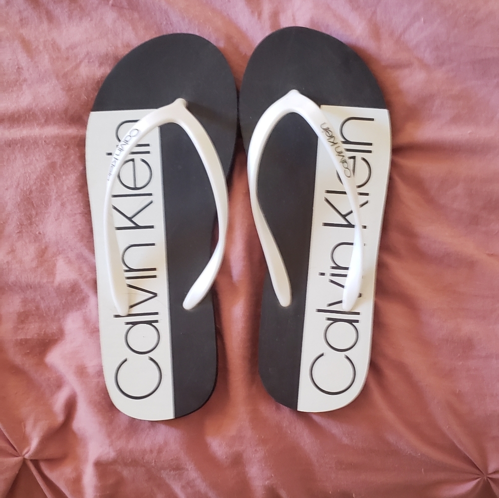 Calvin Klein flip flops.